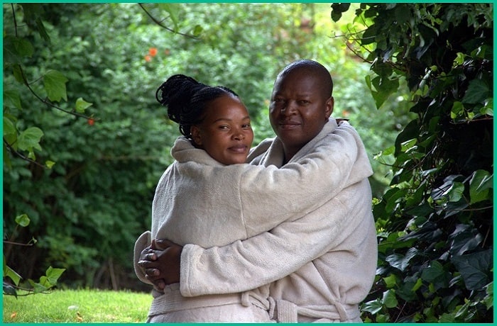 Couple hugging in garden- Home slider